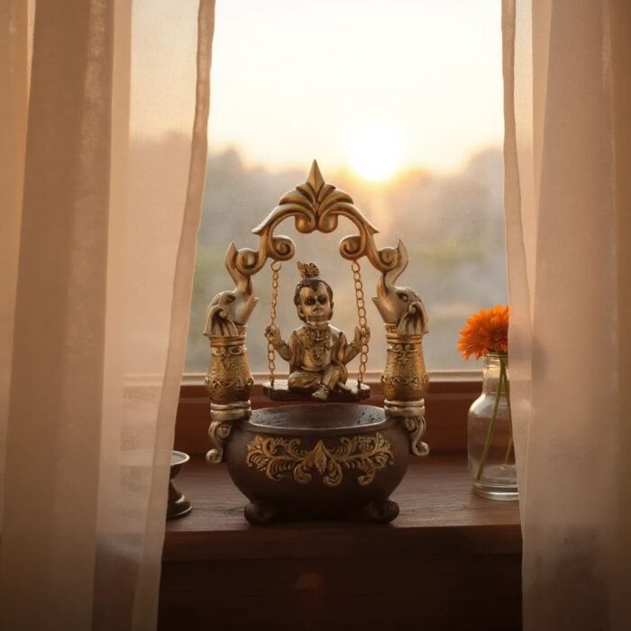 "Cute Hanging Krishna Showpiece – Decorative Lord Ganesh Idol on Swing for Home, Office & Gifting ( 21 cm X 13 cm)"